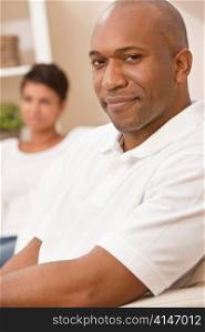 Happy African American Man Woman Couple Sitting At Home