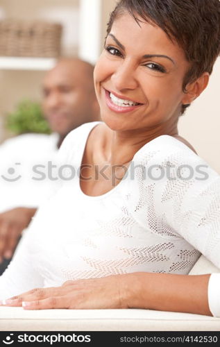 Happy African American Woman Couple Sitting At Home