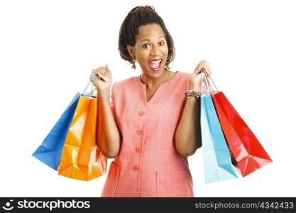 Happy african-american woman with shopping bags. Isolated on white.