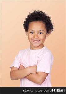 Happy african child with arms crossed isolated on orange background