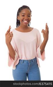Happy african girl with her fingers crossed isolated on white background