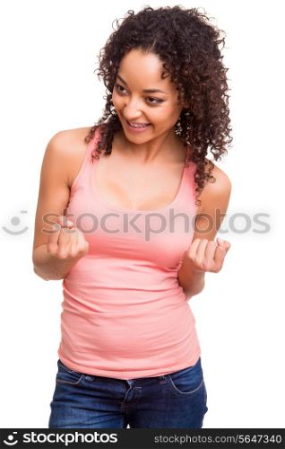 Happy african woman celebrating over white background