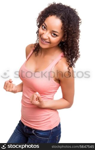 Happy african woman celebrating over white background