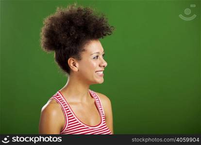 Happy African woman over a green background