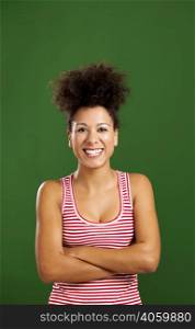 Happy African woman with hands folded over a green background