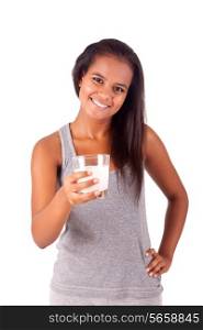 Happy african young female holding a glass of fresh milk