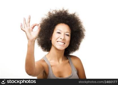 Happy Afro-American young woman isolated on white doing a okay signal with her hand