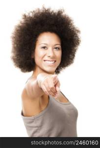 Happy Afro-American young woman isolated on white looking and pointing to the camera