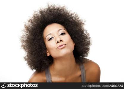 Happy Afro-American young woman isolated on white sending a kiss