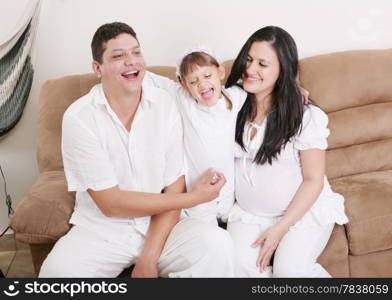 Happy American Family Playing with daughter in the living room