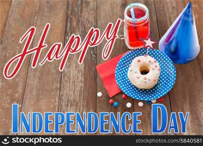 happy american independence day, celebration, patriotism and holidays concept - close up of donut decorated with star, juice in mason jar mug and candies at 4th july party from top