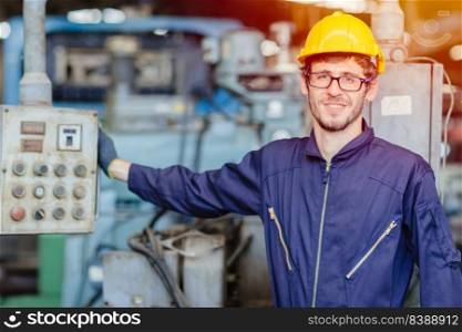 happy american teen worker.engineer smiling for service maintenance fix machine in heavy industy with safty suit and helmet.