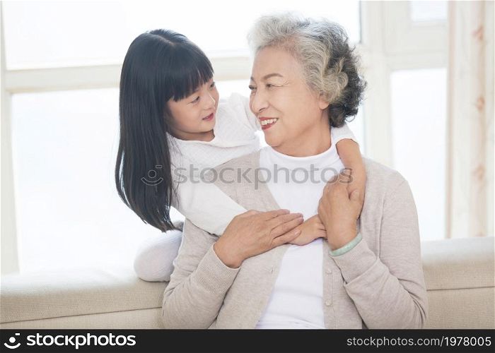 Happy and loving grandma and granddaughter