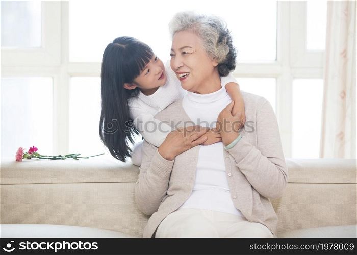 Happy and loving grandma and granddaughter