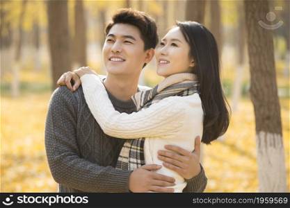 Happy and loving young couple hugging