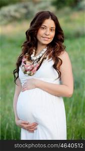 Happy and relaxed pregnant woman waiting her baby
