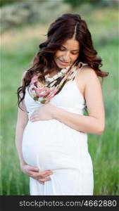 Happy and relaxed pregnant woman waiting her baby