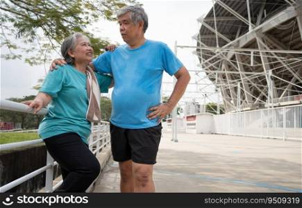 Happy and smile couples elderly asian standing on stairs for rest after workout, jogging on morning, senior exercise outdoor for good healthy. Concept of healthcare and active lifestyle for healthy