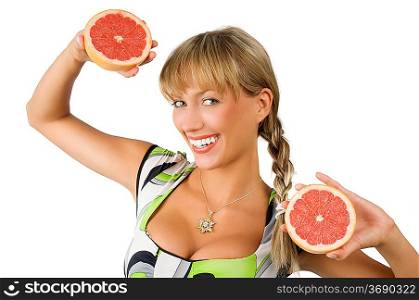 happy and smiling blon girl with green dress and two half grapefruit in hands