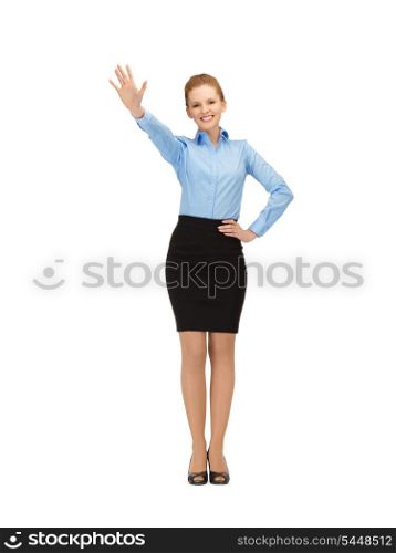 happy and smiling stewardess making greeting gesture