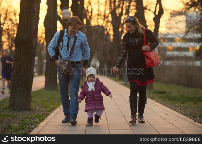 Happy and young pregnant couple have fun and relax outdoor