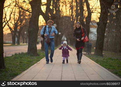 Happy and young pregnant couple have fun and relax outdoor