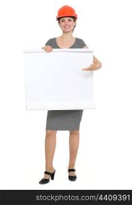 Happy architect woman pointing on blank flip chart. HQ photo. Not oversharpened. Not oversaturated. Happy architect woman pointing on blank flip chart isolated