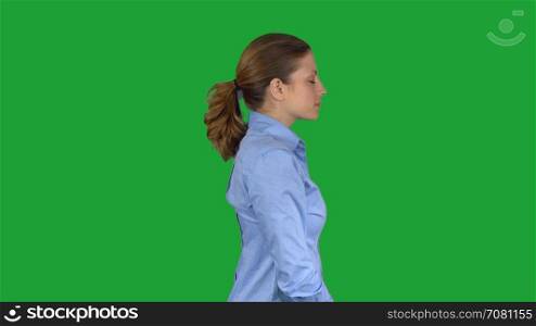 Happy arms crossed working female professional (Green Key)
