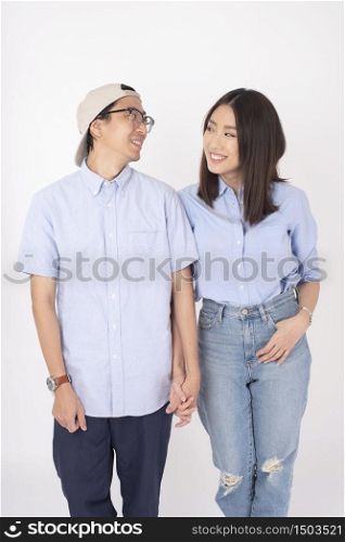 Happy Asian couple in love on white background