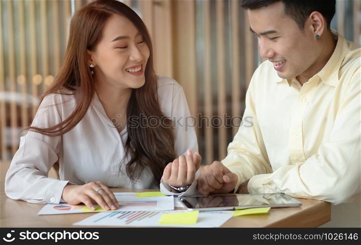 Happy Asian couples be smile after calculating income And expenses because it receives profits from investments. Concepts for investment planning and financial planning for the family.