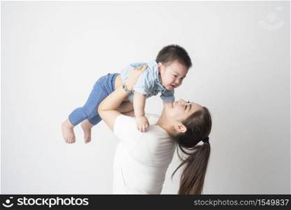 Happy Asian family are enjoy with son in studio