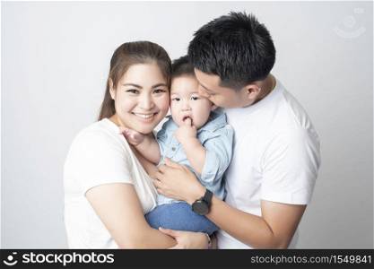 Happy Asian family are enjoy with son in studio