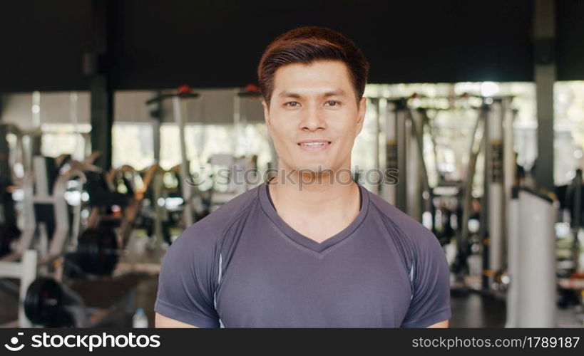 Happy Asian healthy sport man trainer with sportswear smile looking at camera feel cheerful and fresh after workout in gym, People training use in fitness class, sport and healthy lifestyle concept.