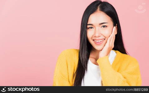 Happy Asian portrait beauty cute young woman teen smiling white teeth surprised excited celebrating gesturing palms on face studio shot isolated on pink background