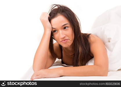 Happy asian woman in bed, isolated over a white background