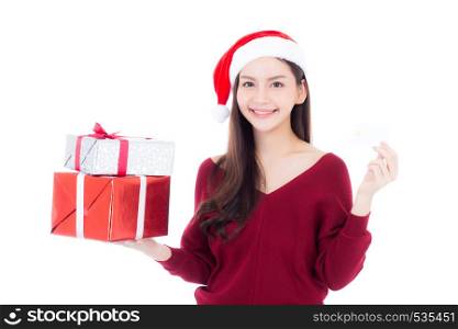 Happy asian woman with smile holding gift box of xmas and credit card, Present girl with celebration christmas a holiday, girl with buyer isolated on white background, shopping with season concept.