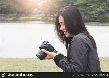 Happy asian women looking photo , Asia summer tourism concept