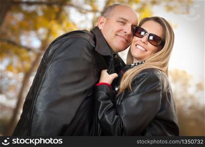 Happy, Attractive Couple in Park with Leather Jackets.