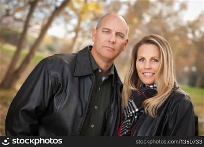 Happy, Attractive Couple in Park with Leather Jackets.