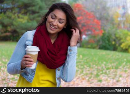 Happy attractive young woman outdoors during autumn