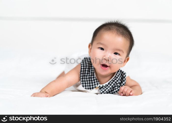 happy baby newborn on a bed