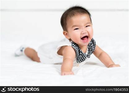 happy baby newborn on a bed