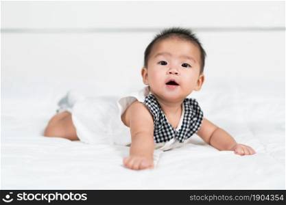 happy baby newborn on a bed