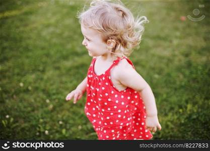 happy baby on green grass background smiling