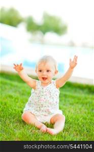 Happy baby playing on grass&#xA;