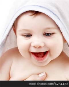 happy baby with terry hoodie robe on head over white