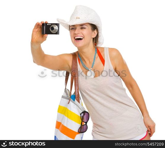 Happy beach young woman taking photo with camera