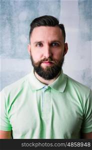 Happy bearded man. Portrait of young adult bearded happy man looking at camera
