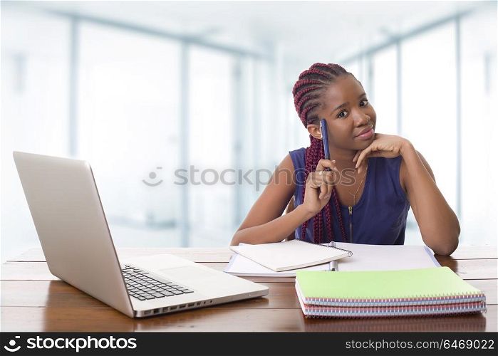 happy beautiful business woman working with a laptop on a desk, at the office