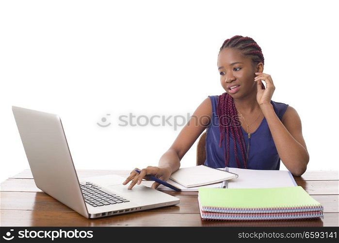 happy beautiful business woman working with a laptop on a desk, isolated on white background